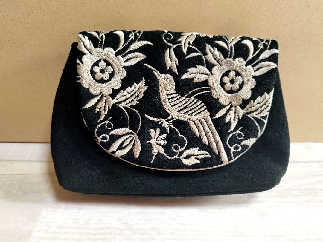 NORMA KAMALI Black Embroidered Shoulder Bag with Floral Design