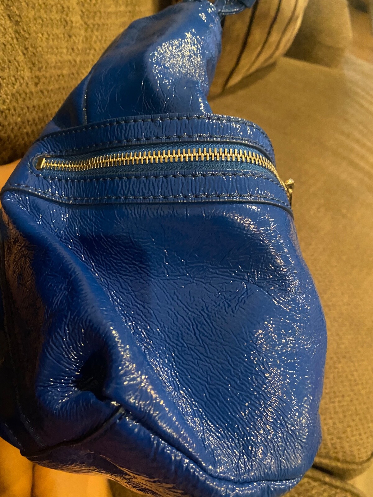 Michael Kors metallic blue, large purse with buckles it 11 inch in heightl