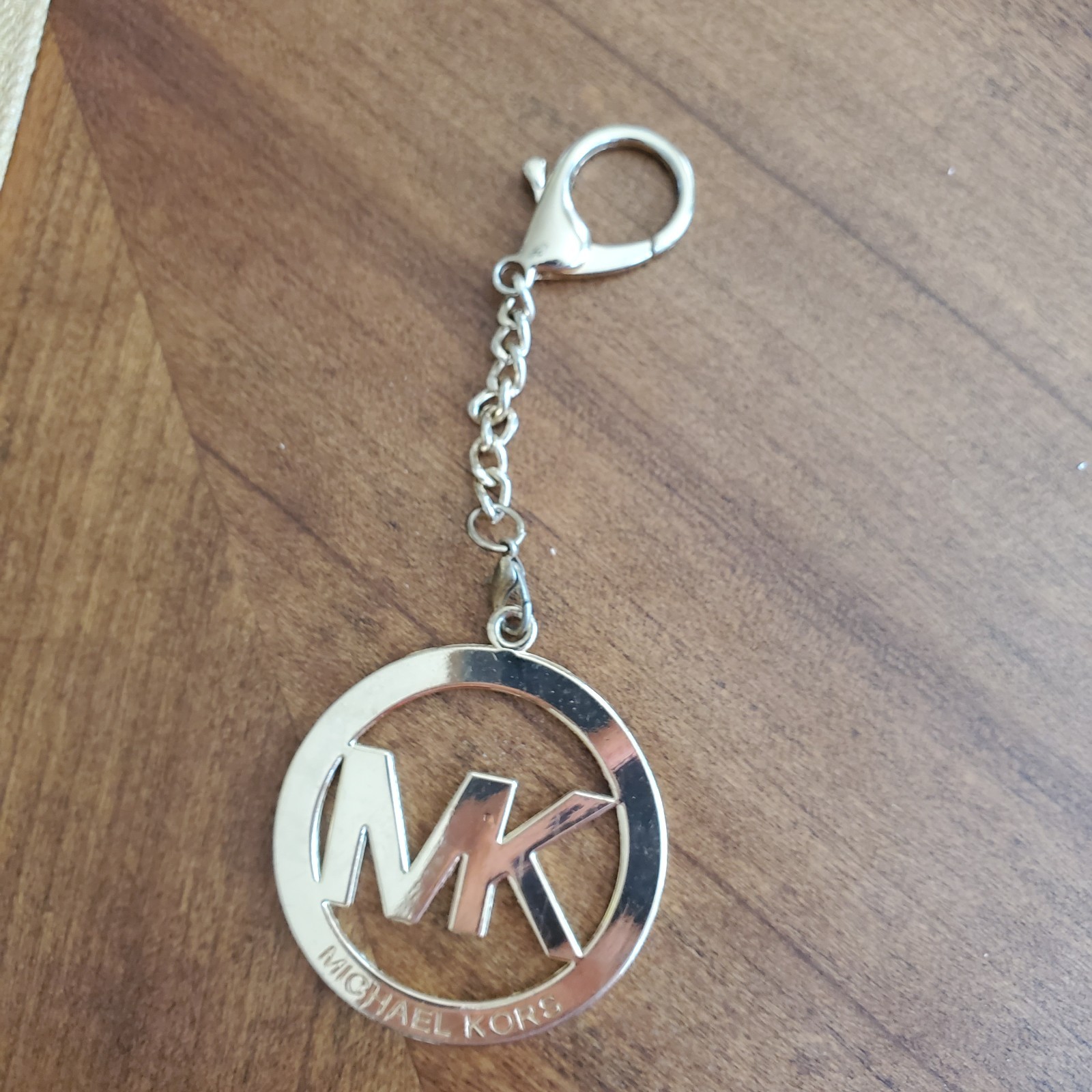 Michael Kors Round Gold Tone Clip On MK Purse Charm w Carabiner