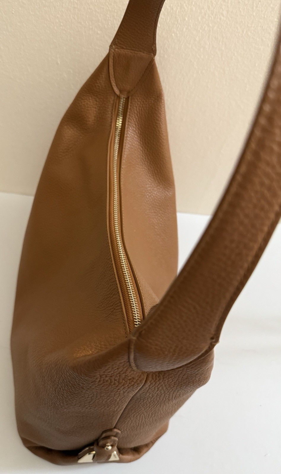 Coccinelle pebbled leather shoulder bag camel color