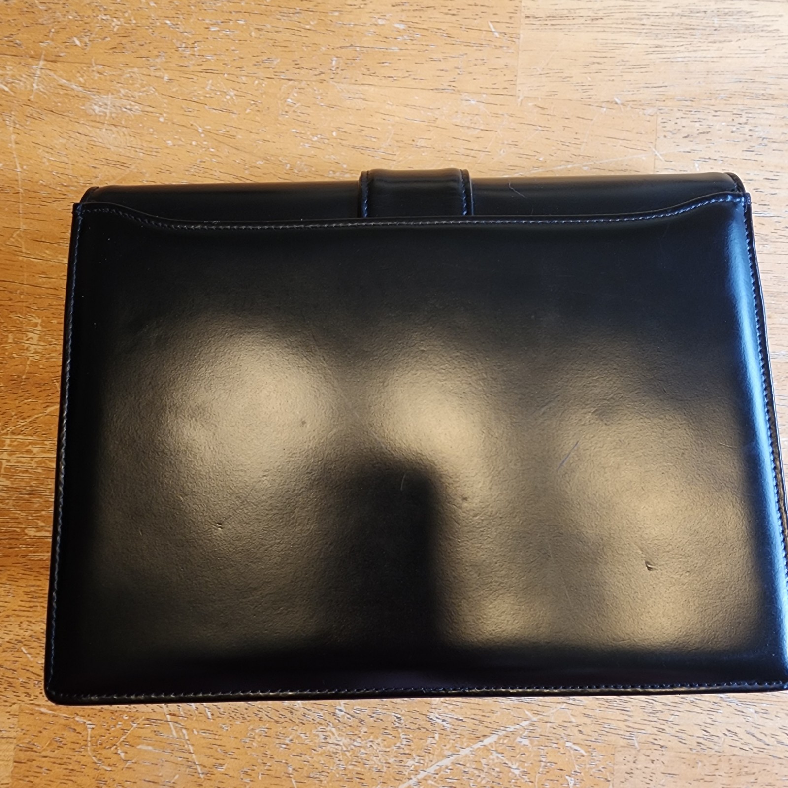 Valentino Garavani Vain clutch bag in black shiny calfskin leather