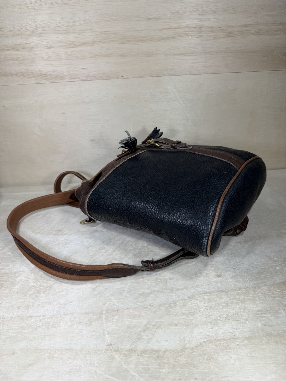 Vintage Dooney & Bourke Black Brown Pebbled Leather Drawstring Backpack Tassels