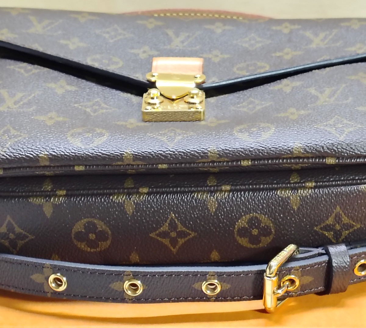 Louis Vuitton Pochette Metis, classic Monogram canvas, polished gold tone S lock