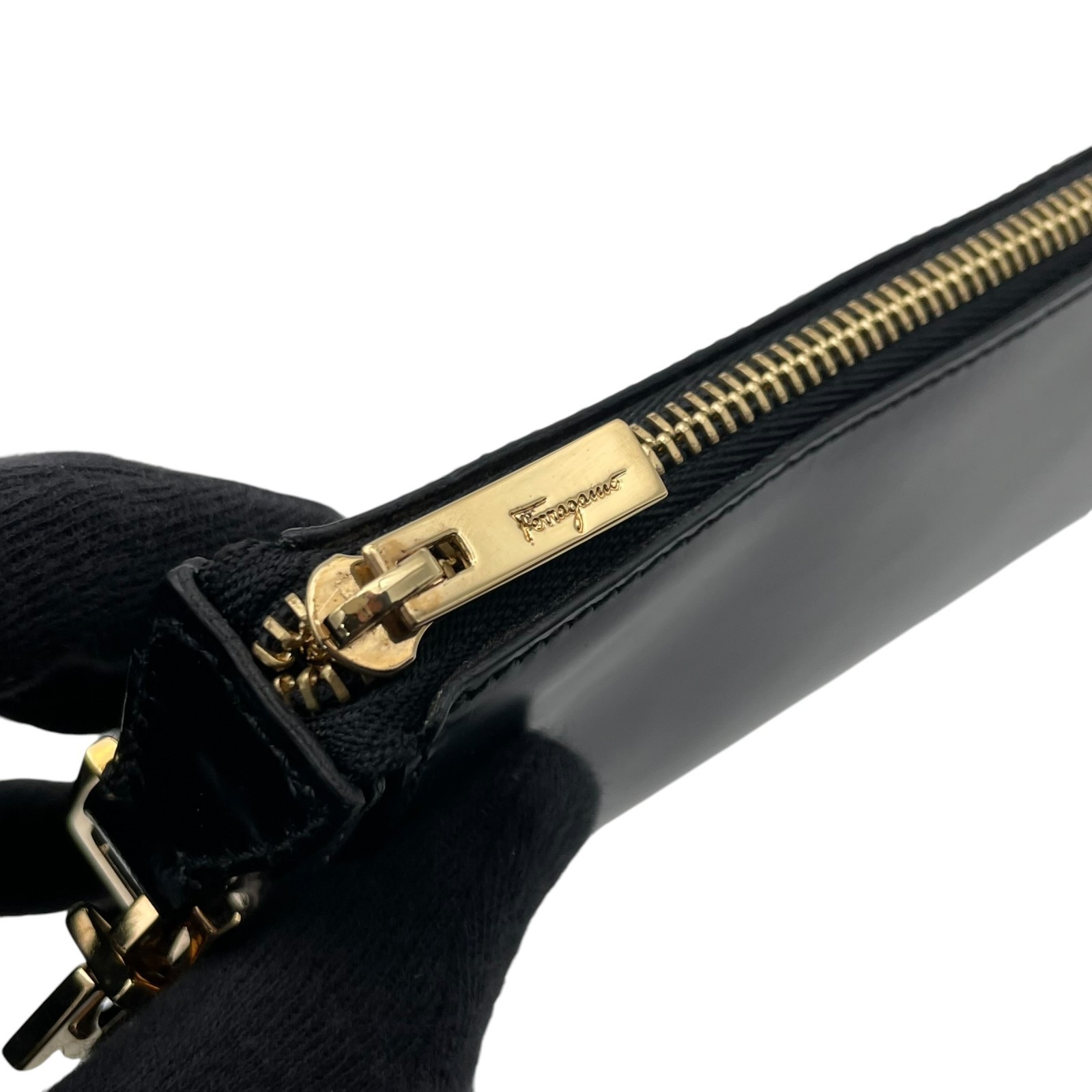 Authentic Salvatore Ferragamo Gancini Leather Accessory Pouch Black Gold