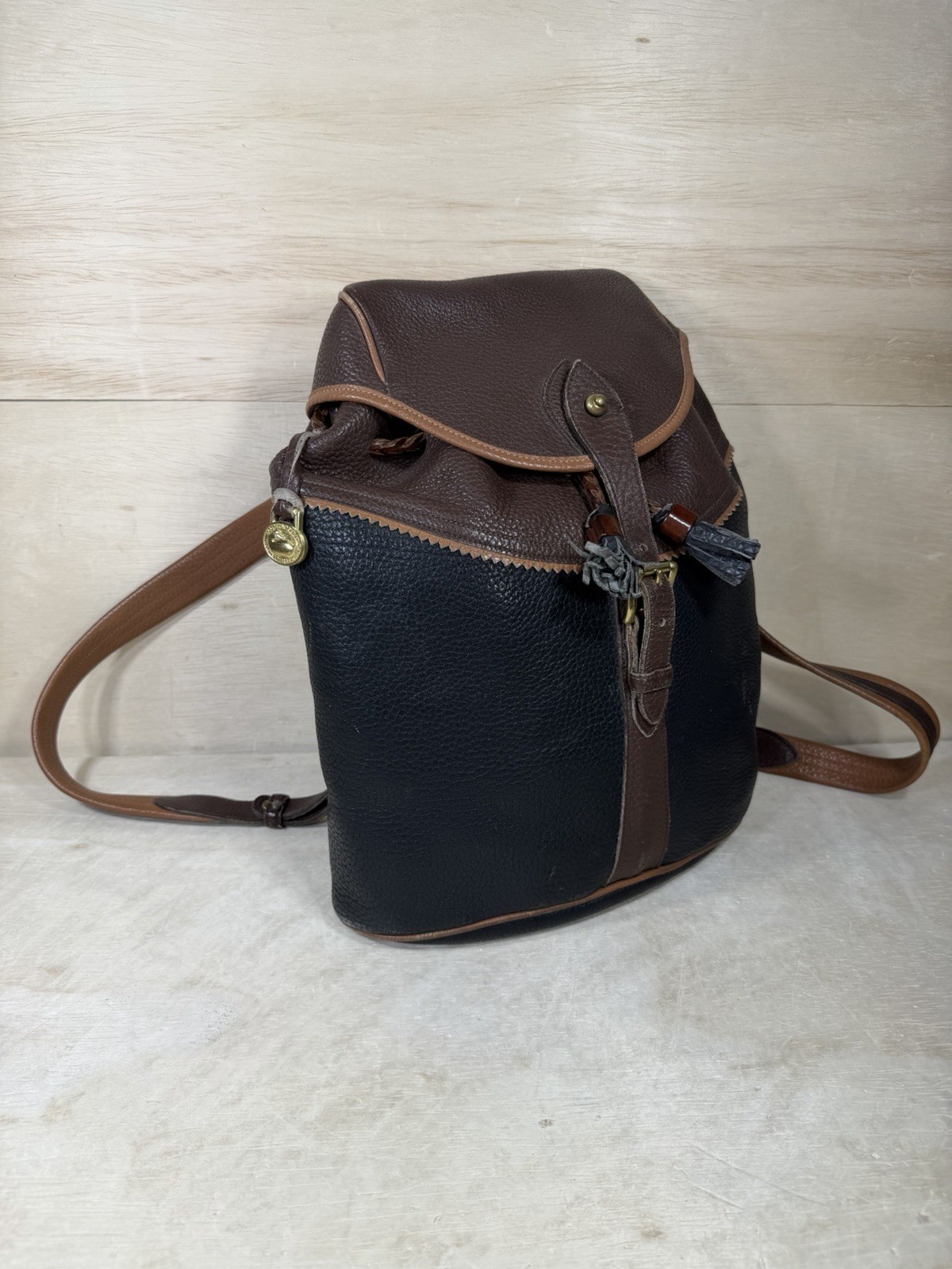 Vintage Dooney & Bourke Black Brown Pebbled Leather Drawstring Backpack Tassels