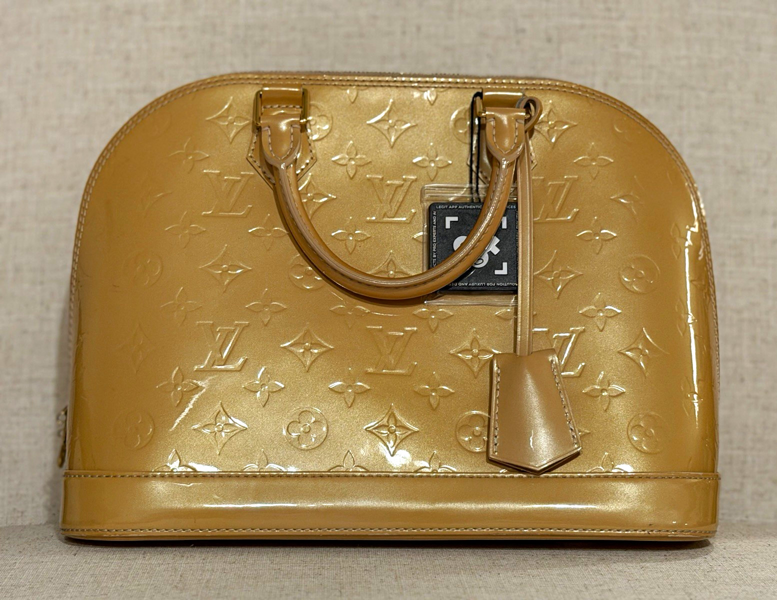 Louis Vuitton Monogram Vernis Alma Top Handle Bag Beige Gold Tone Lock Zip