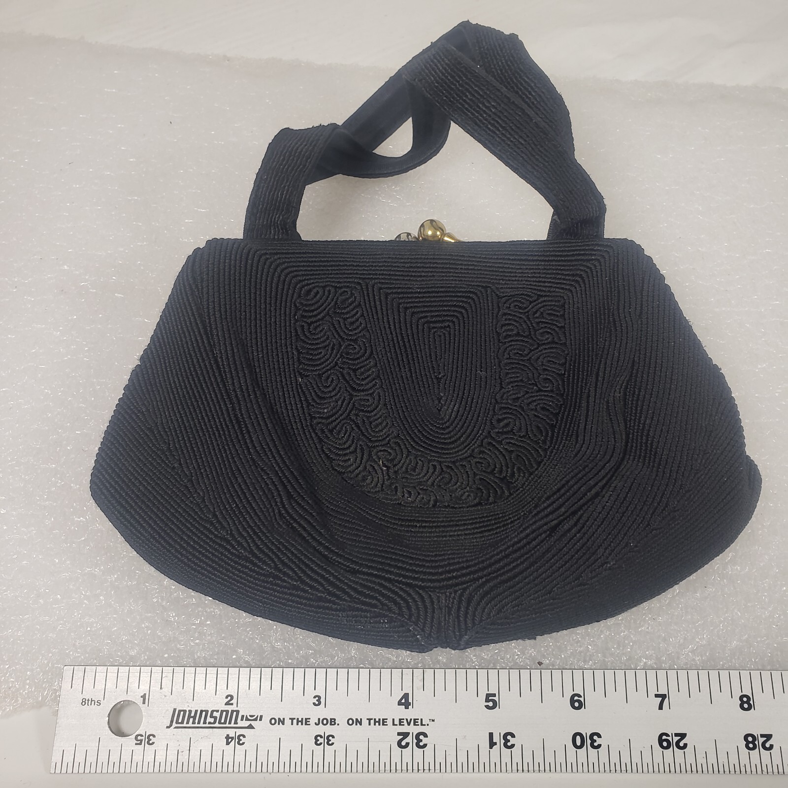 Small Black Corde Hand Bag Snap Closure 1 Zip Interior Pocket 1 Open Used Worn