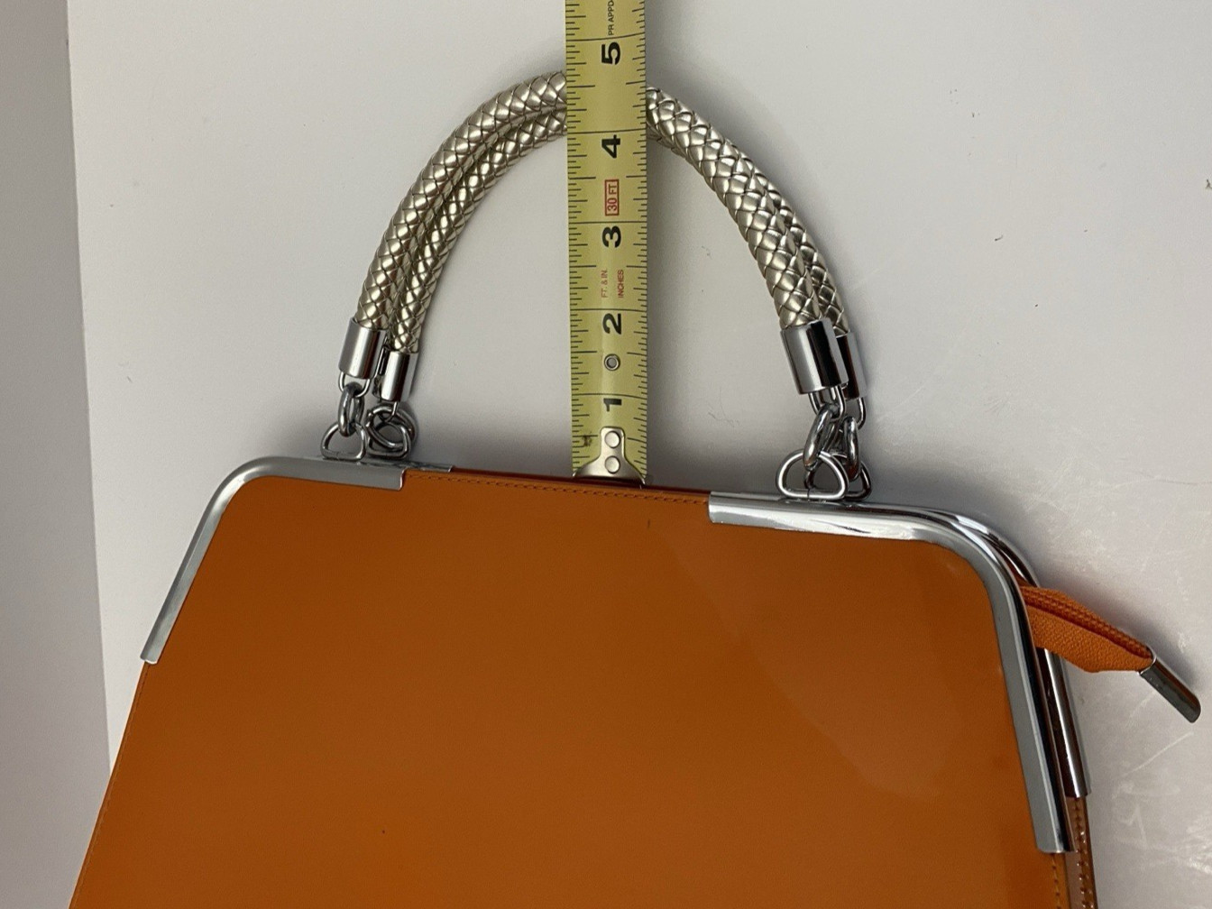 MC Collection handbag Glossy Orange with Braided silver handle and strep Pre own
