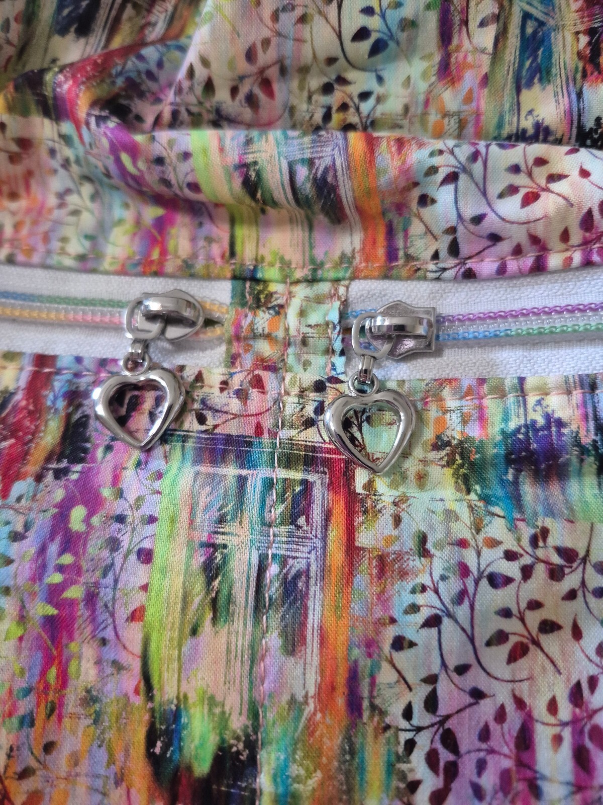 Colorful Drawstring Backpack with Quilted Bottom and Heart-Shaped Zipper Pulls