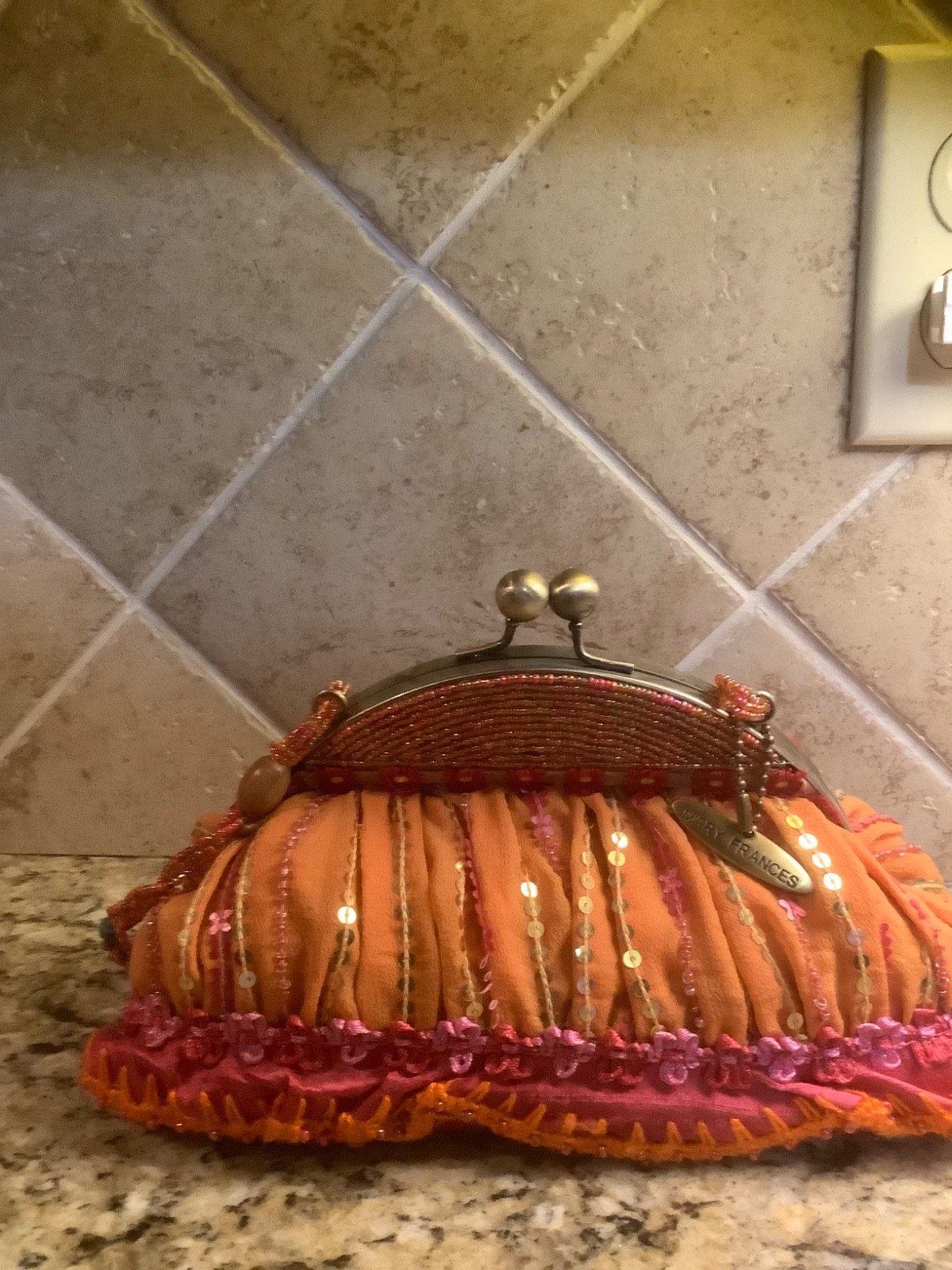 Mary Francis should beg in orange, deep pink, rose red with touches of turquoise