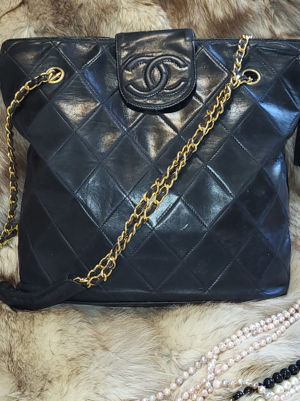 CHANEL Black Quilted Shoulder Bag Gold Chain Strap Tassel Logo Accent Designer