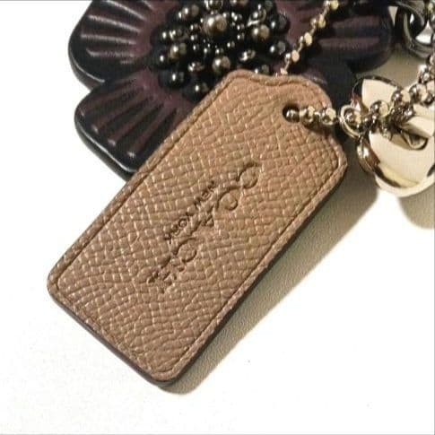 Excellent condition COACH tea rose bag charm turn lock key holder 10a