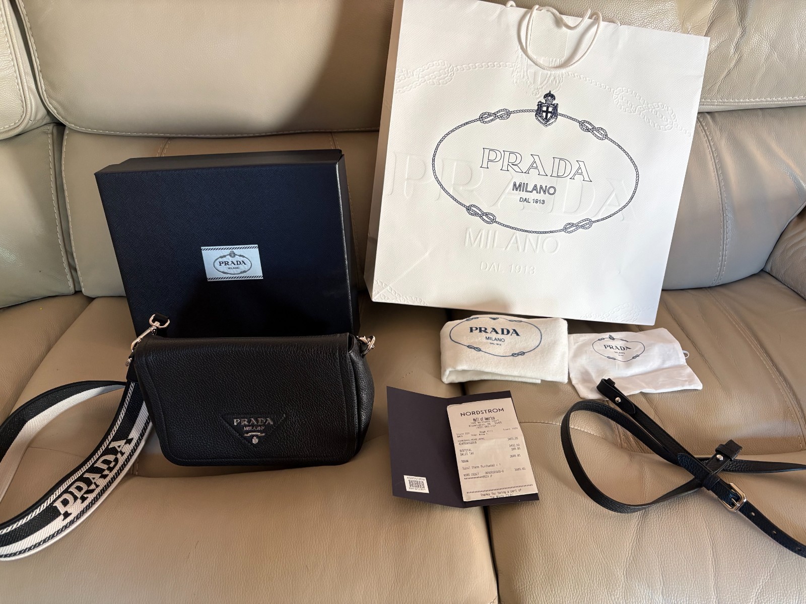Prada Vitello Daino leather flap crossbody bag with logo web strap