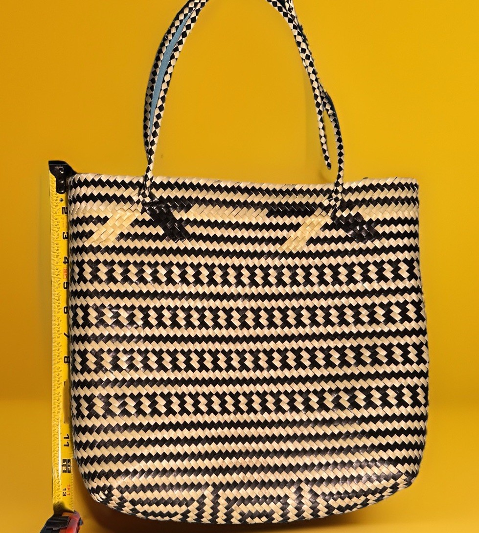 a handwoven Oaxaca 100% recycle tote featuring a black & Tan geometric pattern.
