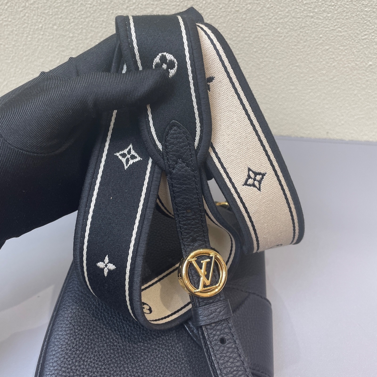 Louis Vuitton Pont 9 black calfskin crossbody bag with gold-tone hardware.