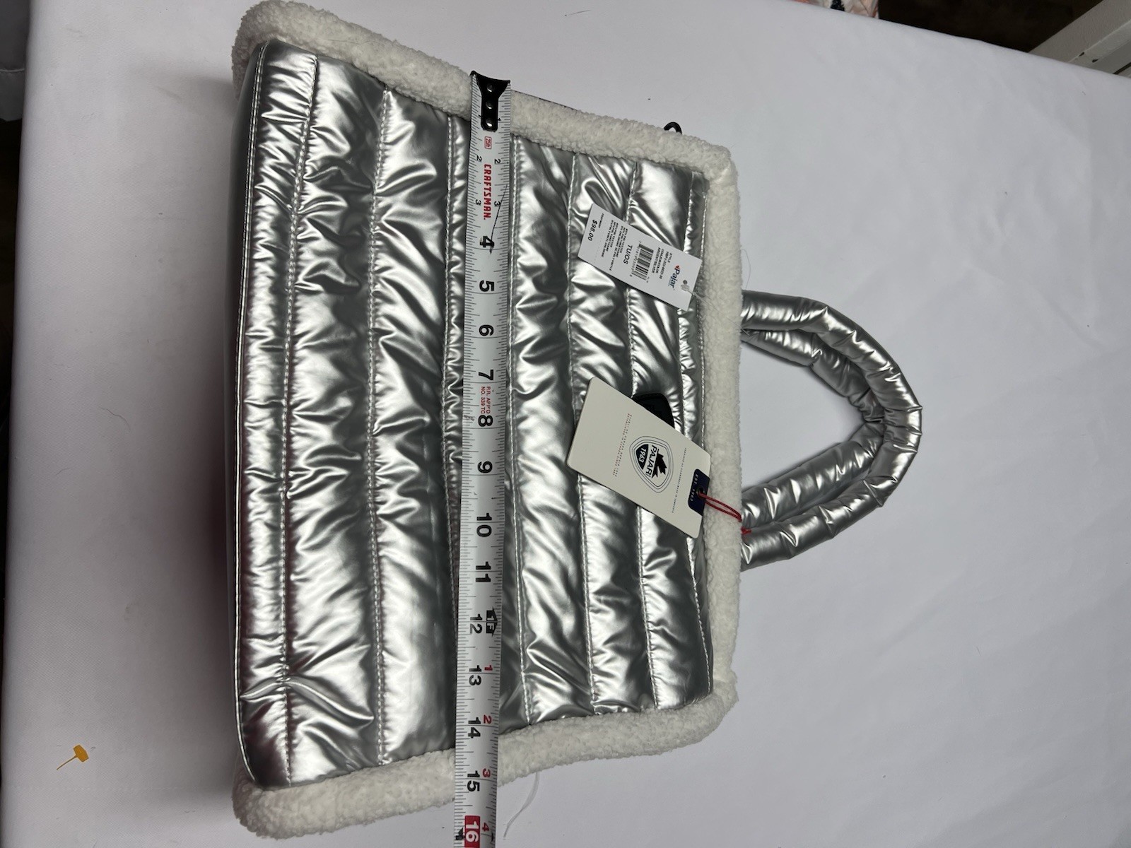 The Pajar 1963 Shearling Puffy Tote is a metallic silver quilted bag NWT