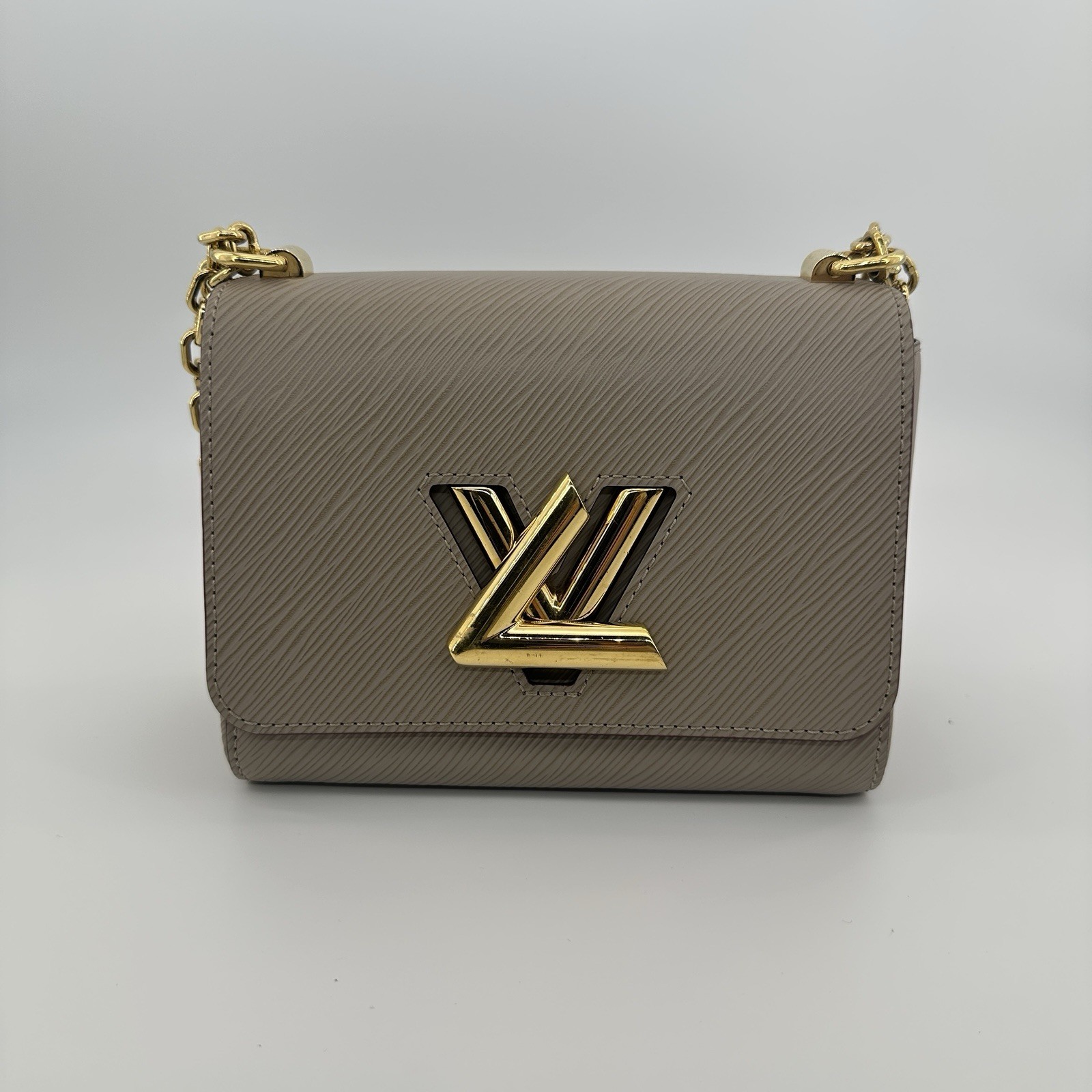 Louis Vuitton Twist PM Crossbody Bag Gold-tone hardware. In very good condition.