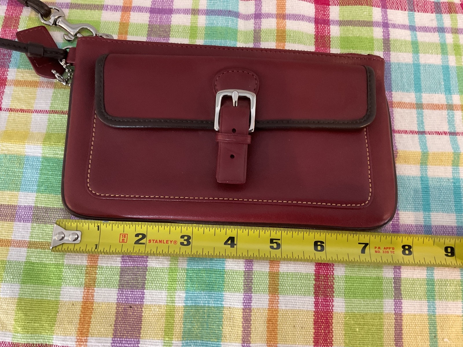COACH. Burgundy Leather SOHO Clutch Wristlet Buckle Snap Silver Hardware NWOT