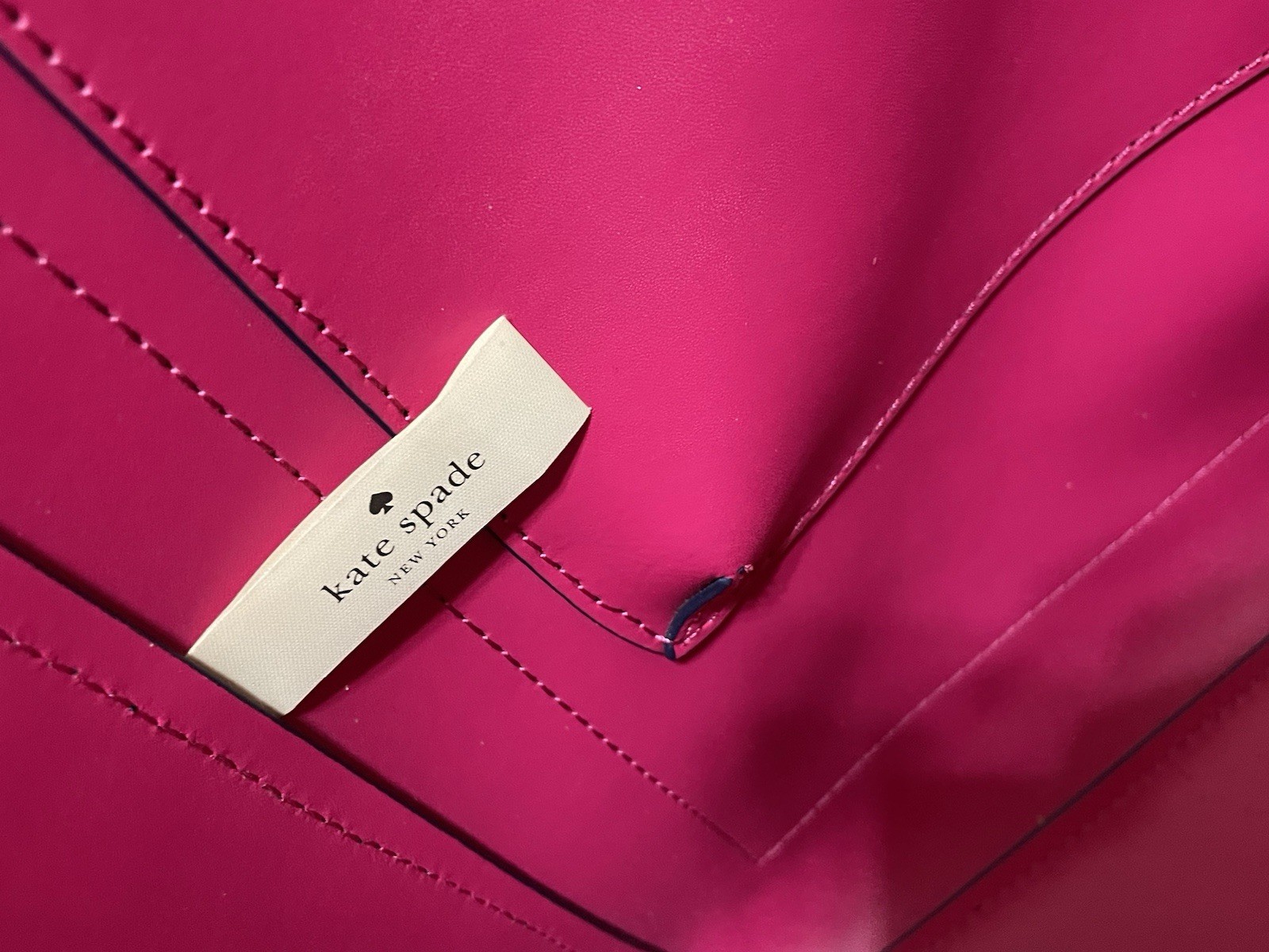 Kate Spade Arbour Hill Elodie leather tote bag in navy blue with a pink interior