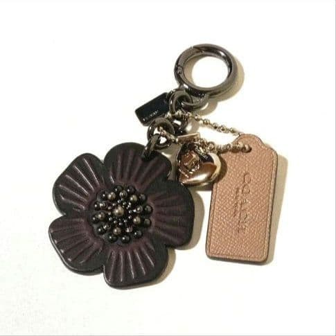 Excellent condition COACH tea rose bag charm turn lock key holder 10a