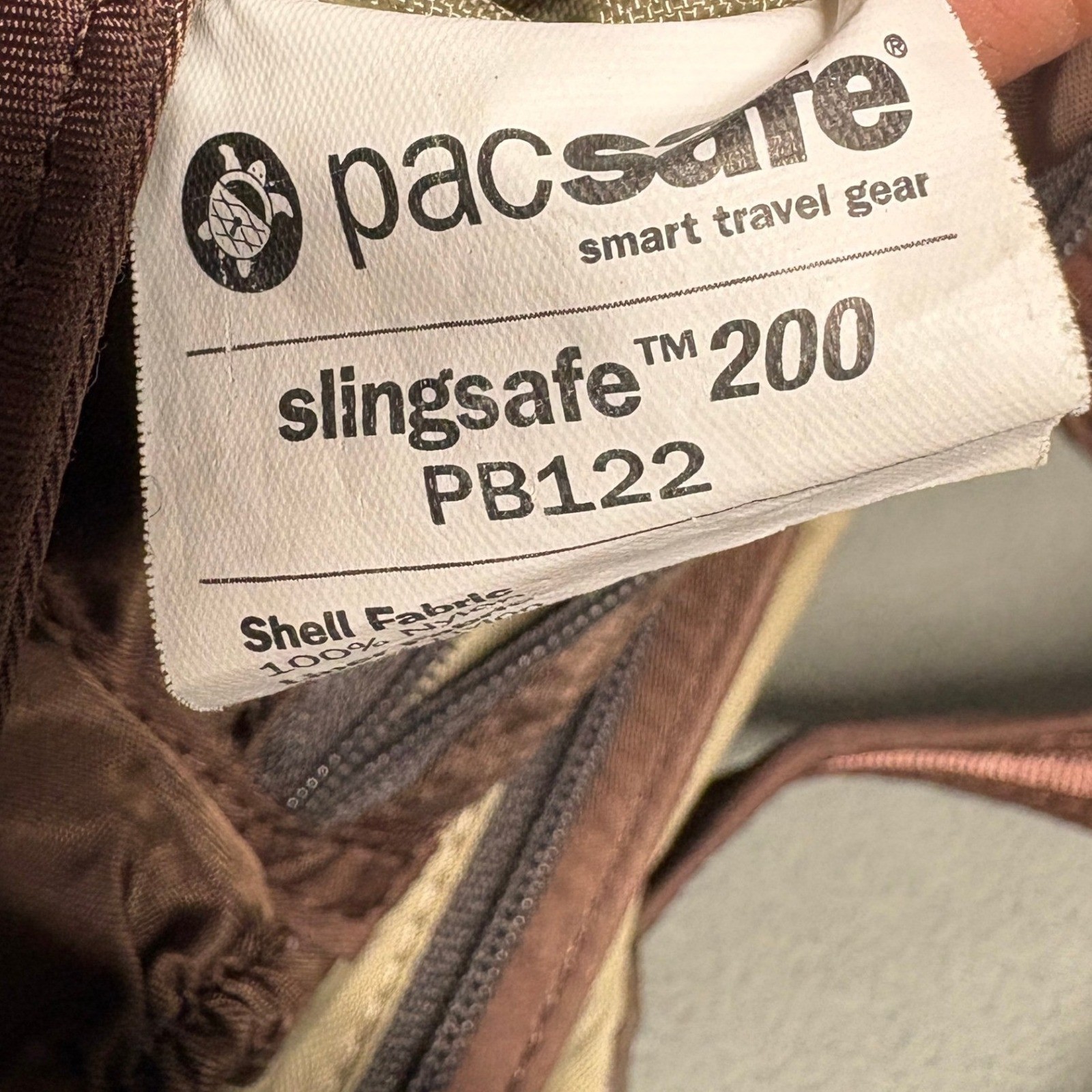 PACSAFE SlingSafe 100 Exomesh Anti-Theft Safety Crossbody Bag in Brown