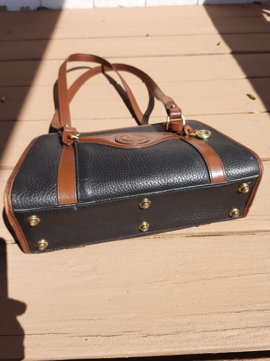 Dooney and Bourke Black With Brown Trim Leather Handbag