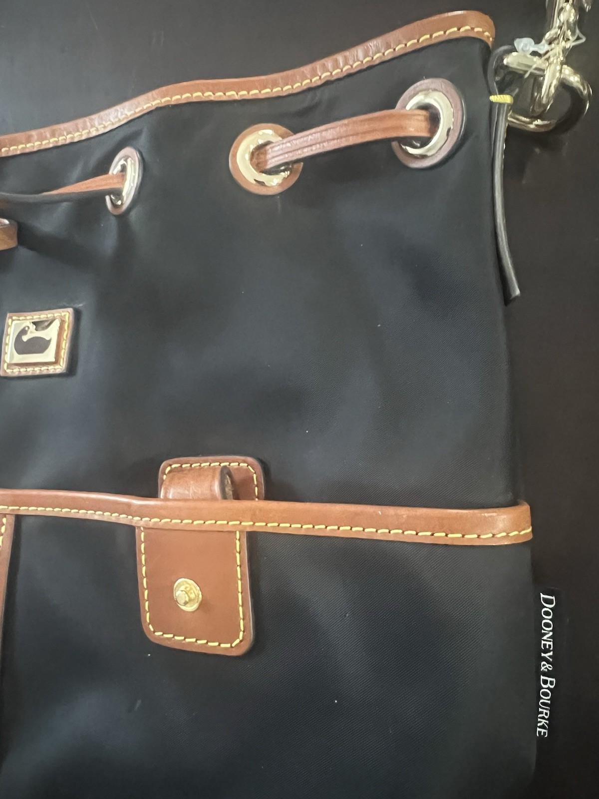 Dooney & Bourke Black Bucket Bag with Brown Leather Trim & Detachable Strap