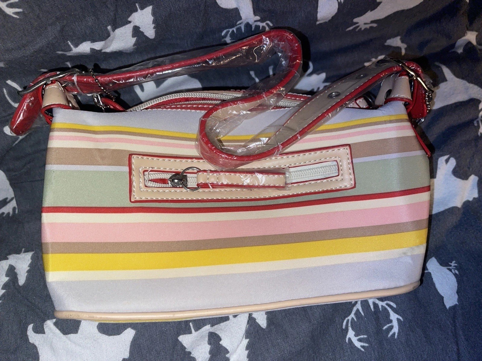 Vintage multi-colored Coach handbag. Never been used. Large on the inside.