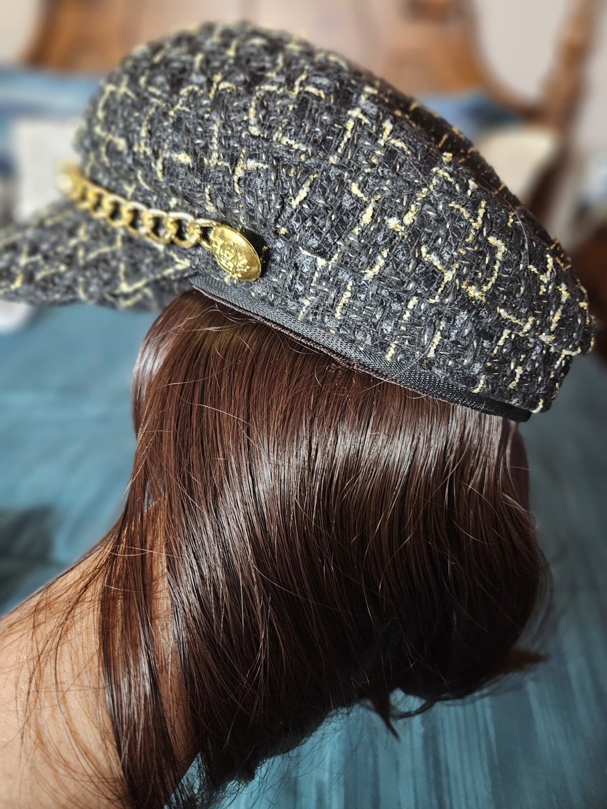 Set of Bradgley Mischka croosbody bag and unbranded hat with wig attached to it.