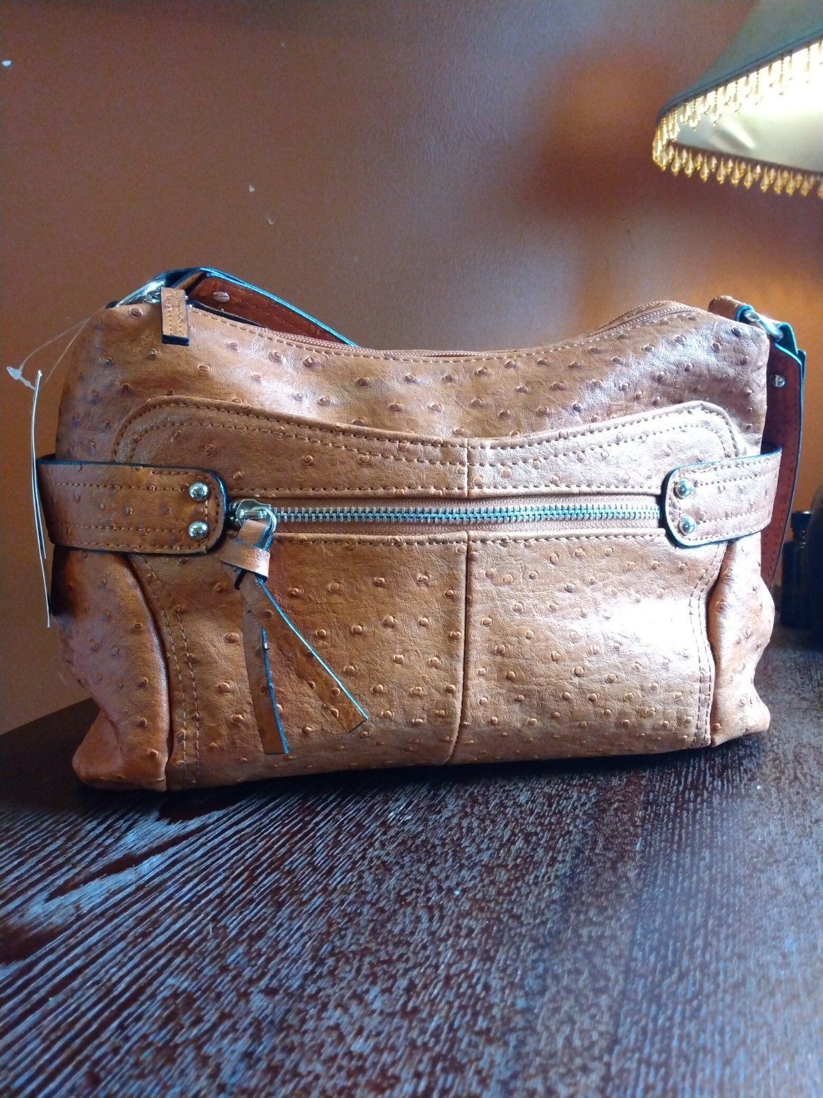 New (never used)Bueno collection handbag textured ostrich style finish in tan