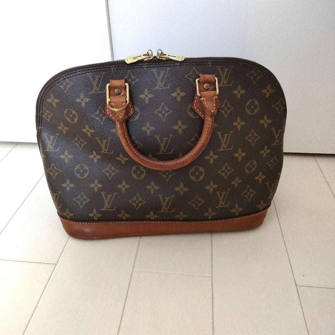 Louis Vuitton Alma Monogram Handbag Nume Leather Used