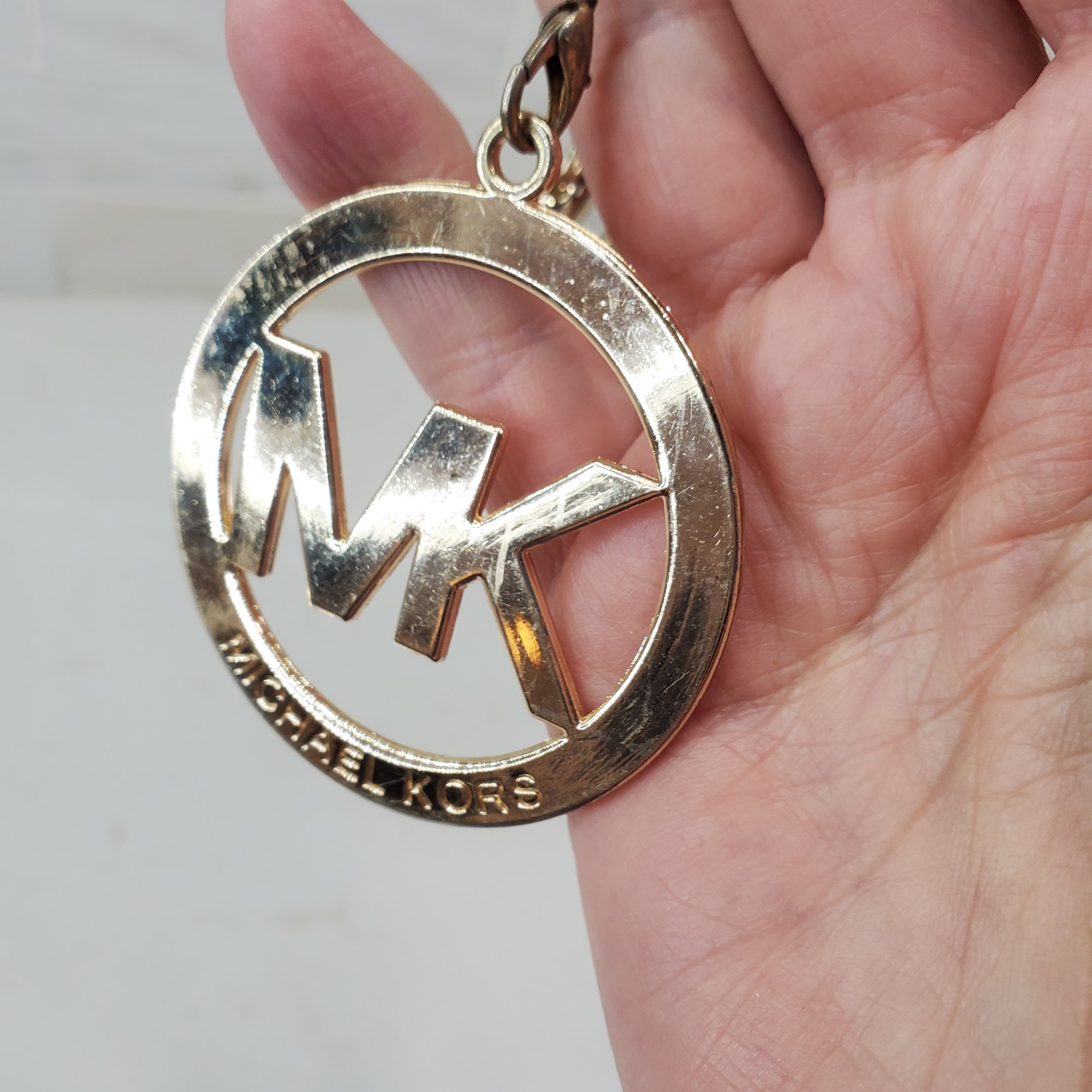 Michael Kors Round Gold Tone Clip On MK Purse Charm w Carabiner