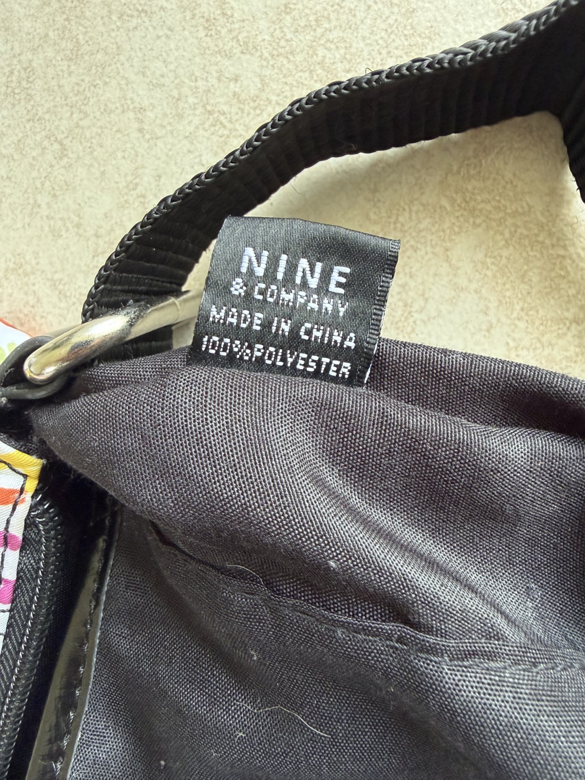 9 & Co. crossbody With outside zip pocket and outside snap pocket