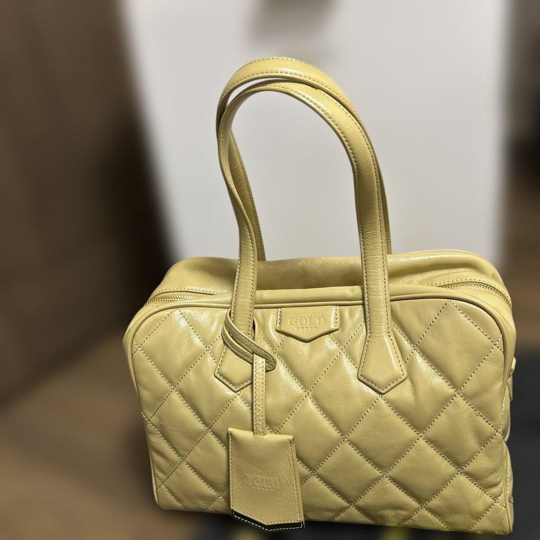 COCOCELUX GOLD Beige Leather Quilted Handbag with Pink Interior and Gold Detail