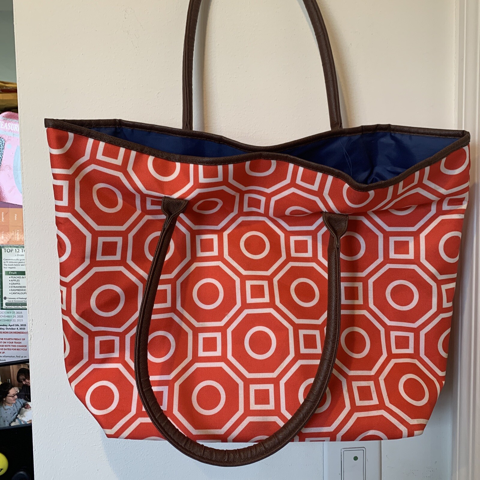 Tangerine Geometric pattern tote with a cobalt blue lining