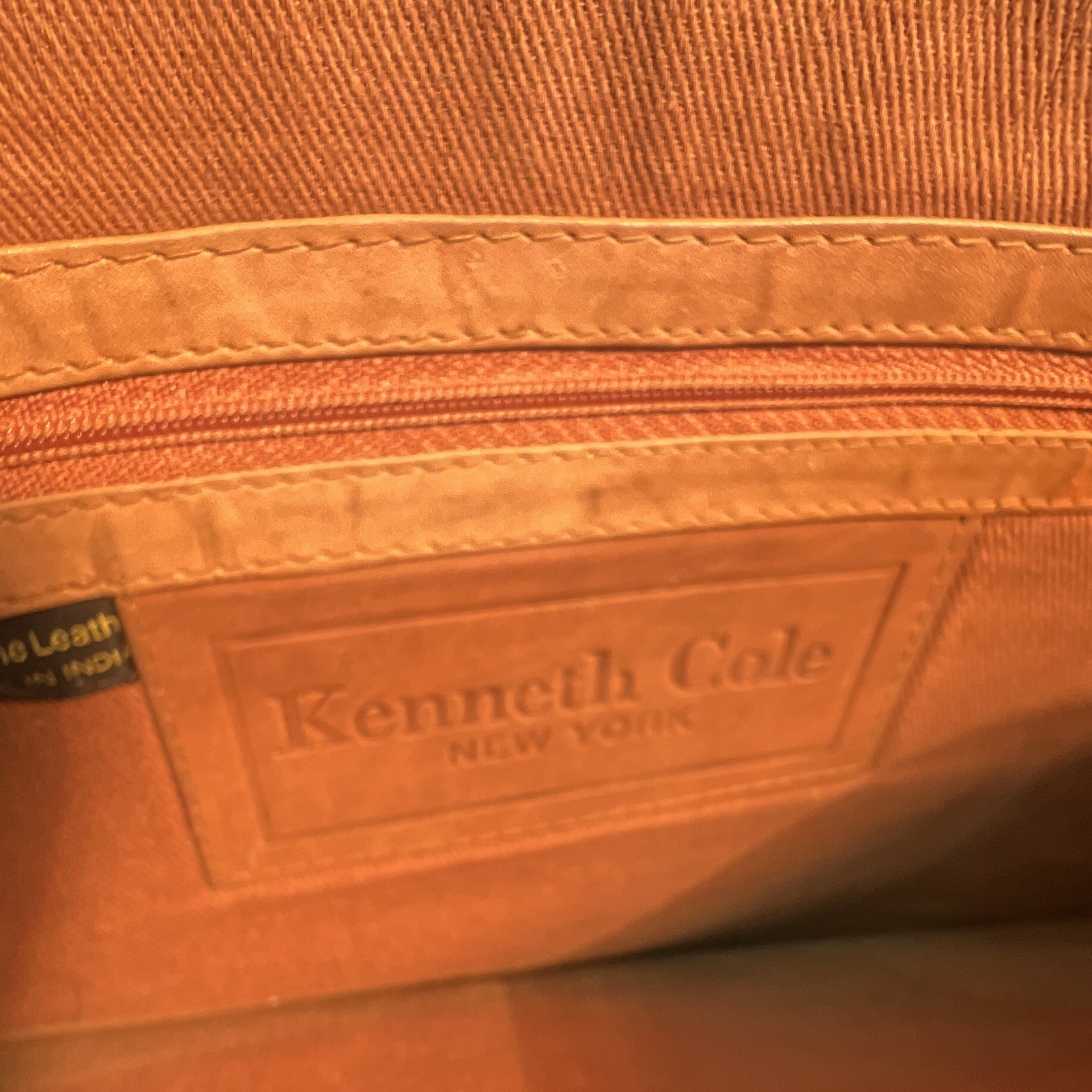 Kenneth Cole New York Brown Embossed Shoe Pattern Zip Clutch Wrist Strap