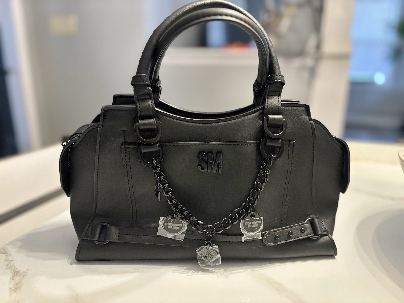 Steve Madden Black Satchel with Chain Charm, Logo & Buckle Accent, Zip Closure