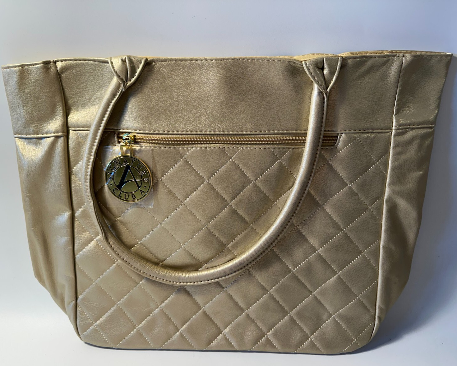 Signature Club A metallic gold colored tote bag w/handles 12.5″x17″ faux leather