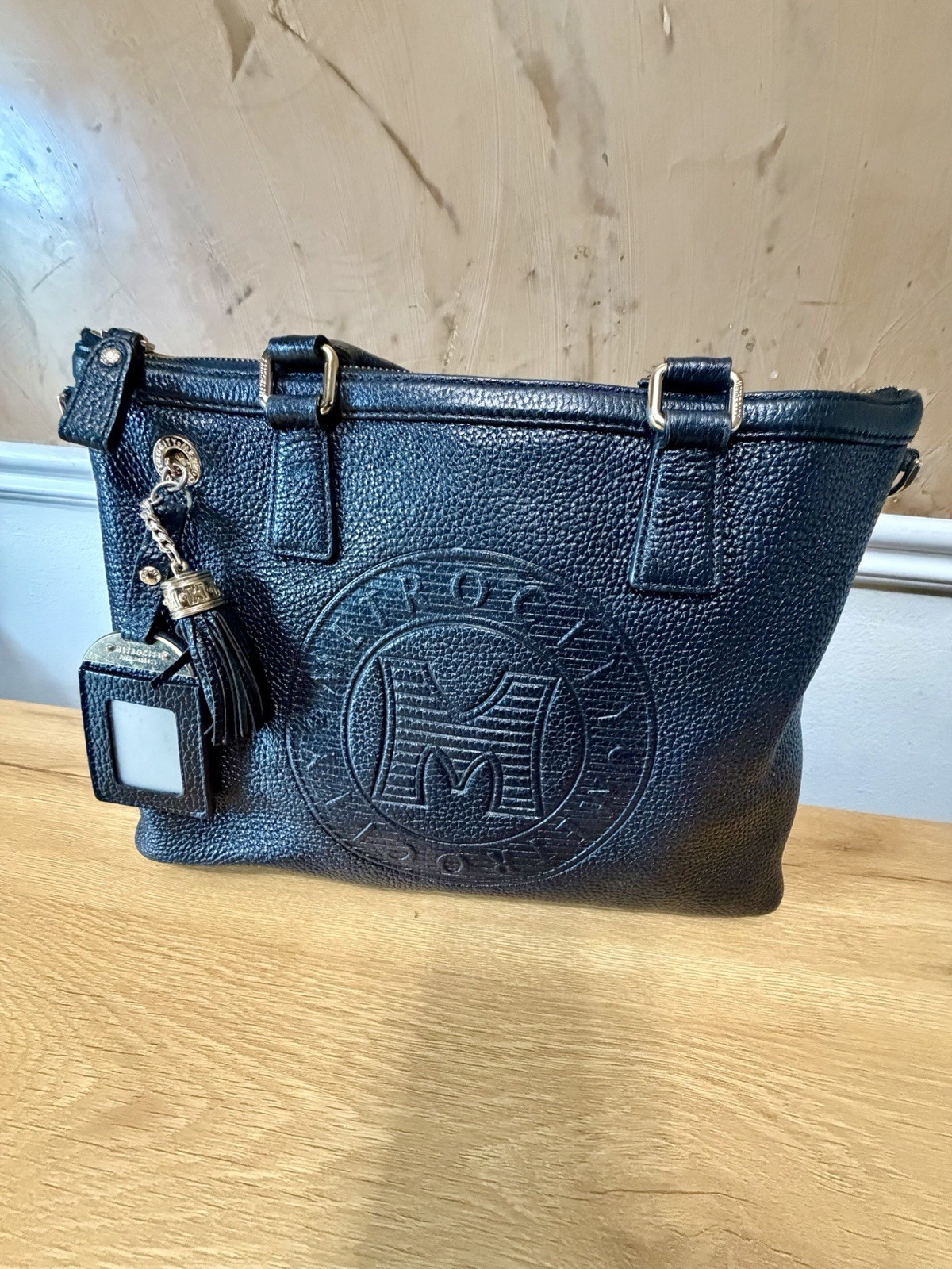 Metrocity Black Pebbled Leather Tote Bag Tassel Charm Large Logo Purse