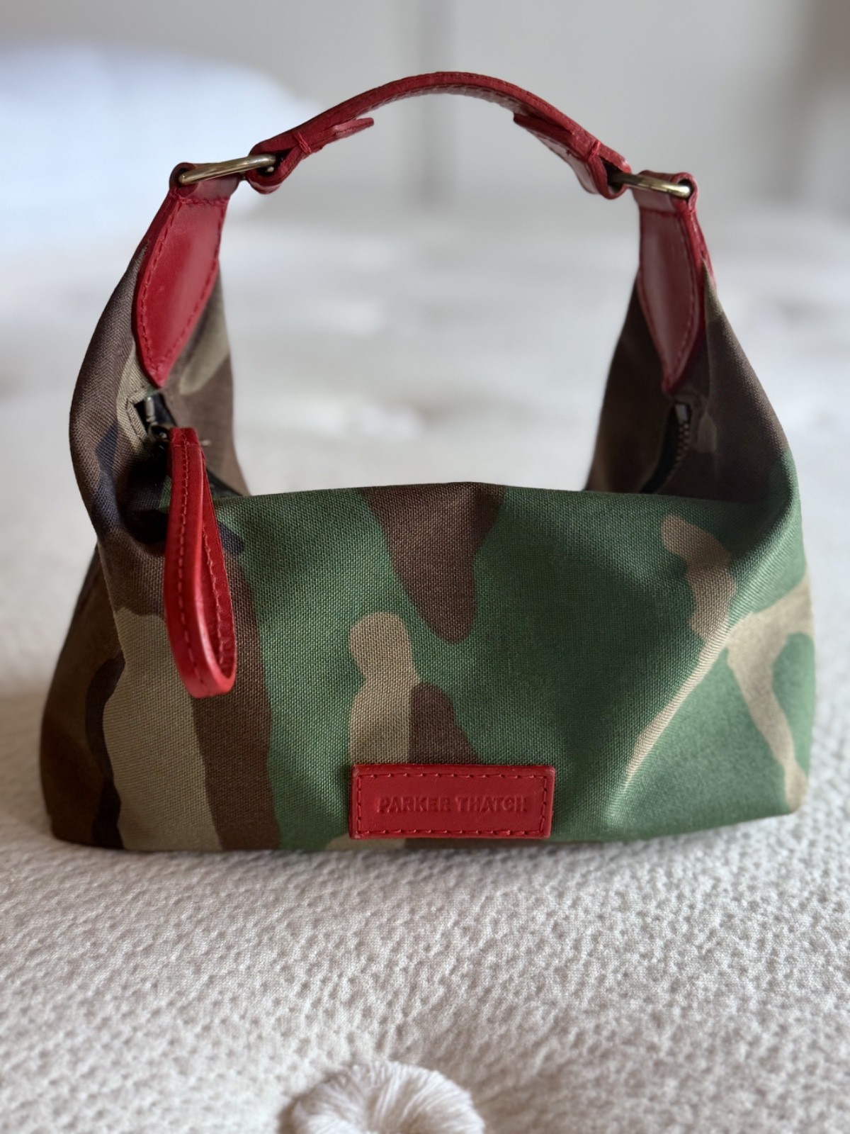 Parker Thatch small Maurice Hobo Bag in Camo with red handle, no visible wear