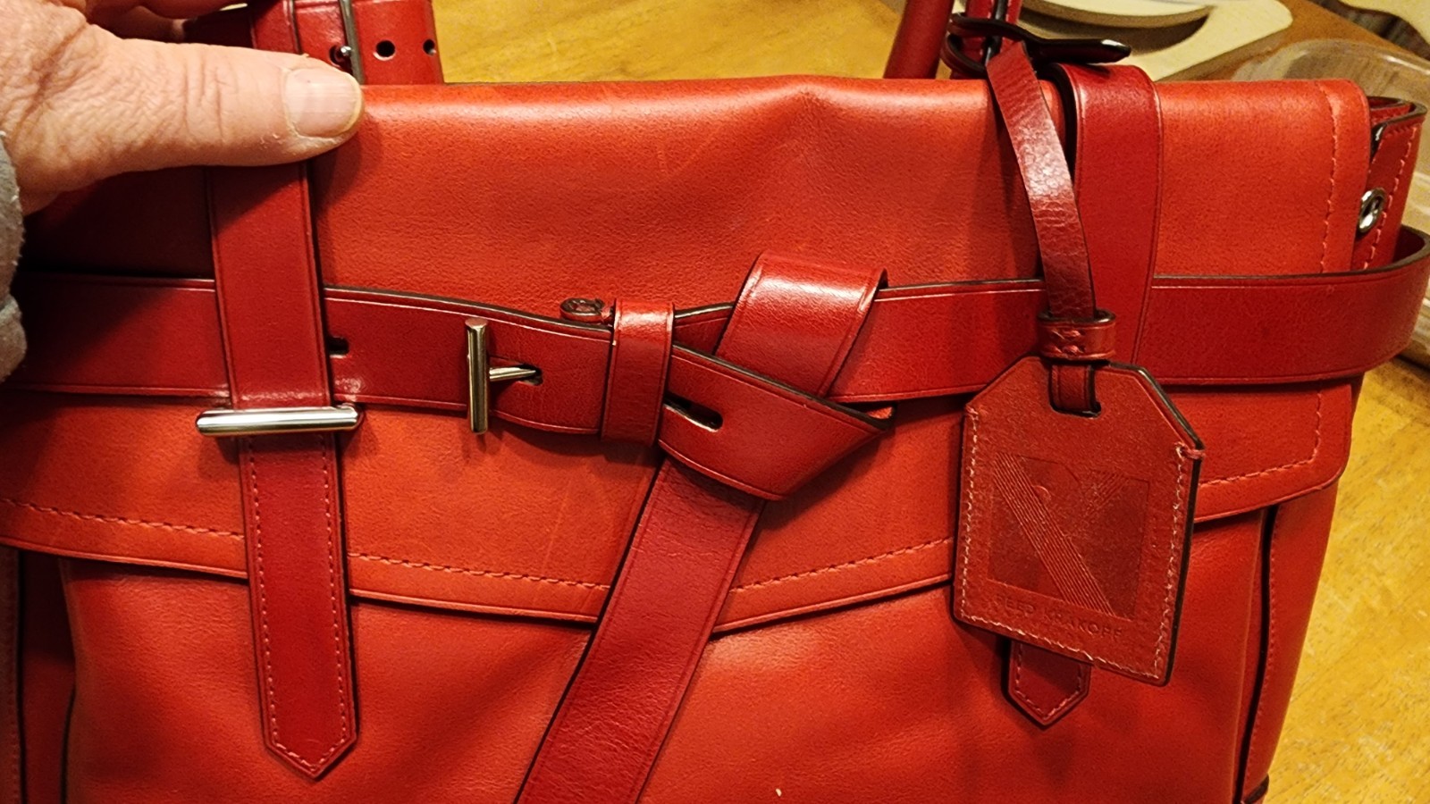 red leather Reed Krakoff Boxer Tote Bag, dual rolled handles & belt detailing.