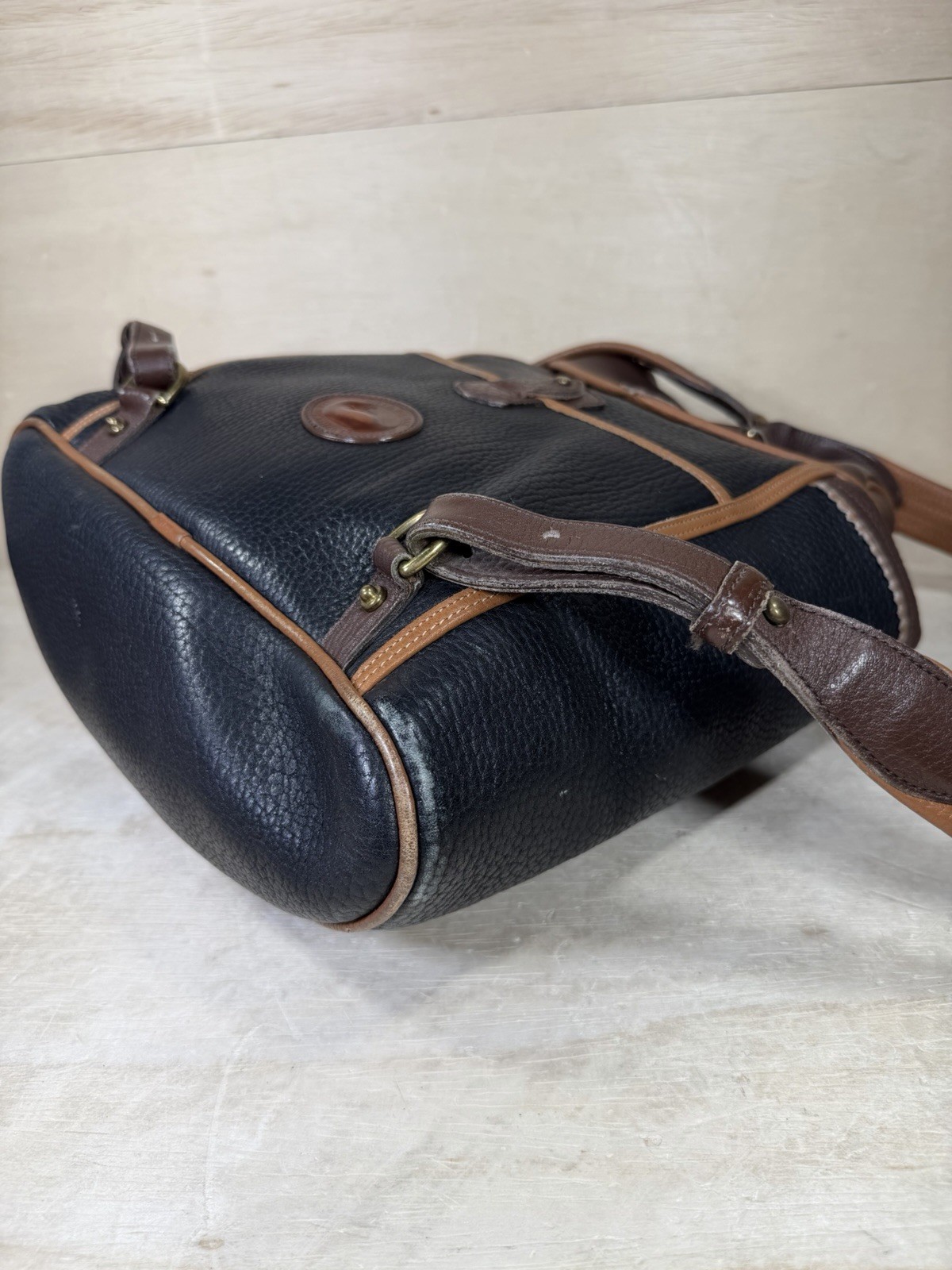 Vintage Dooney & Bourke Black Brown Pebbled Leather Drawstring Backpack Tassels