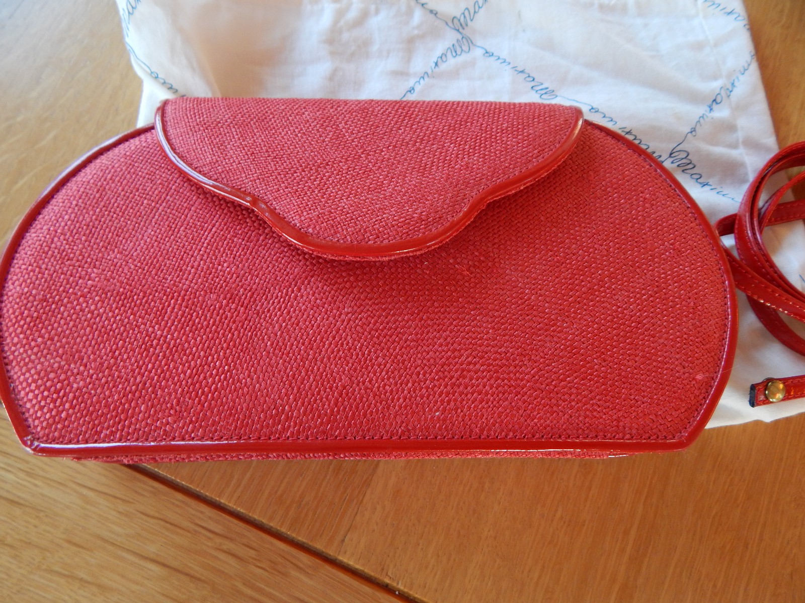0DEA MADE IN ITALY RED LINEN FABRIC CLUTCH WITH 46” DETACABLE STRAP.