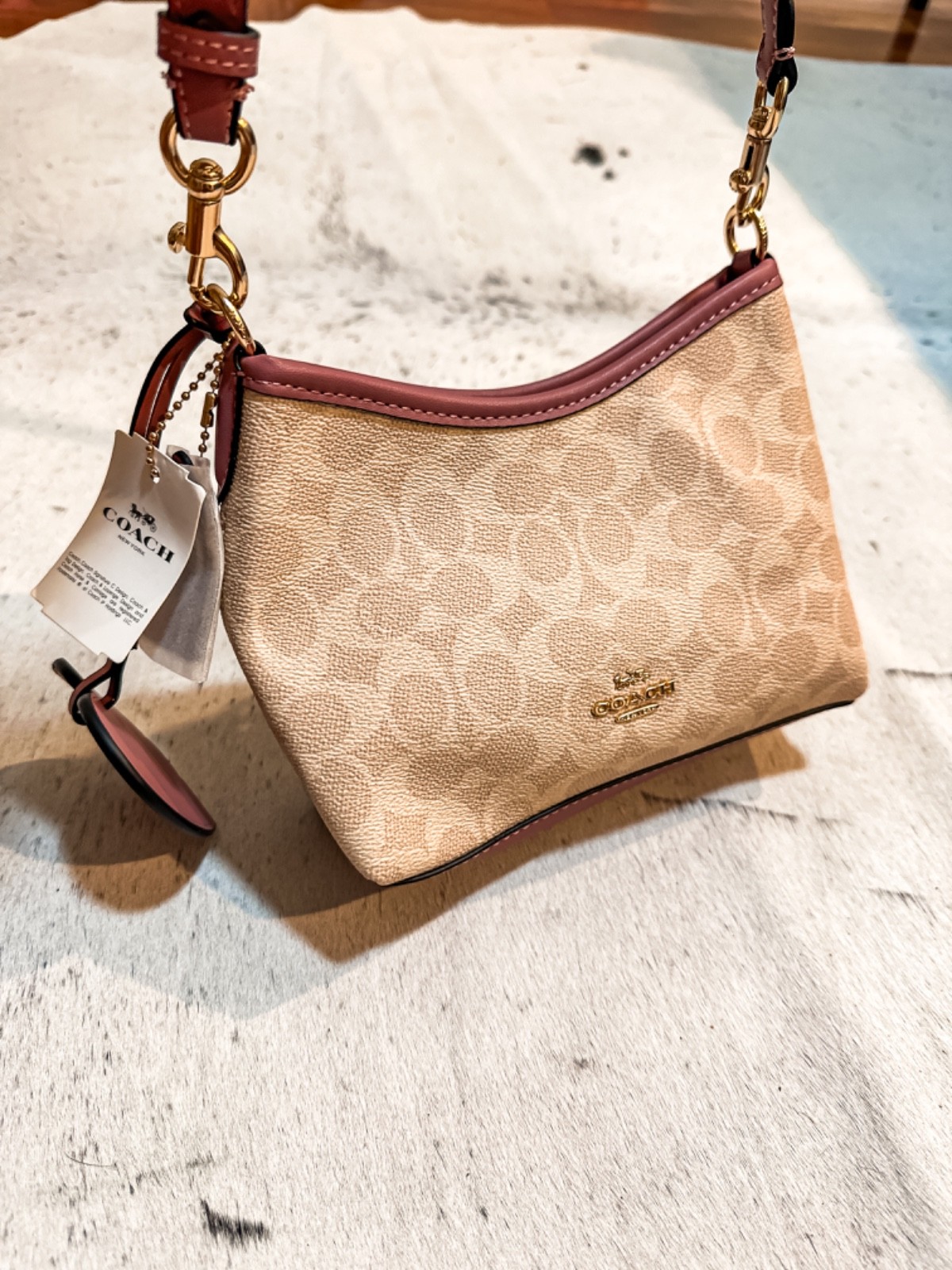 coach bag tan and pink with heart charm