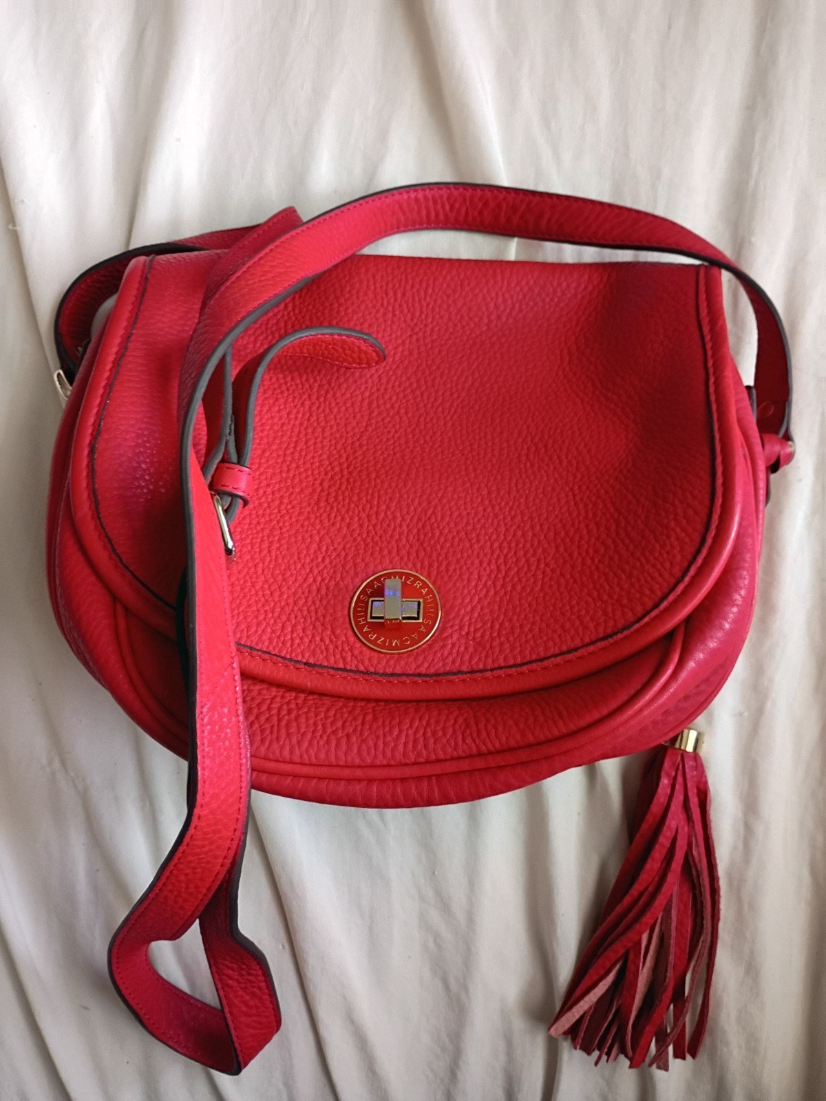 Authentic Isaac Mizrahi Red Pebbled Leather Crossbody Saddle Bag with Tassel