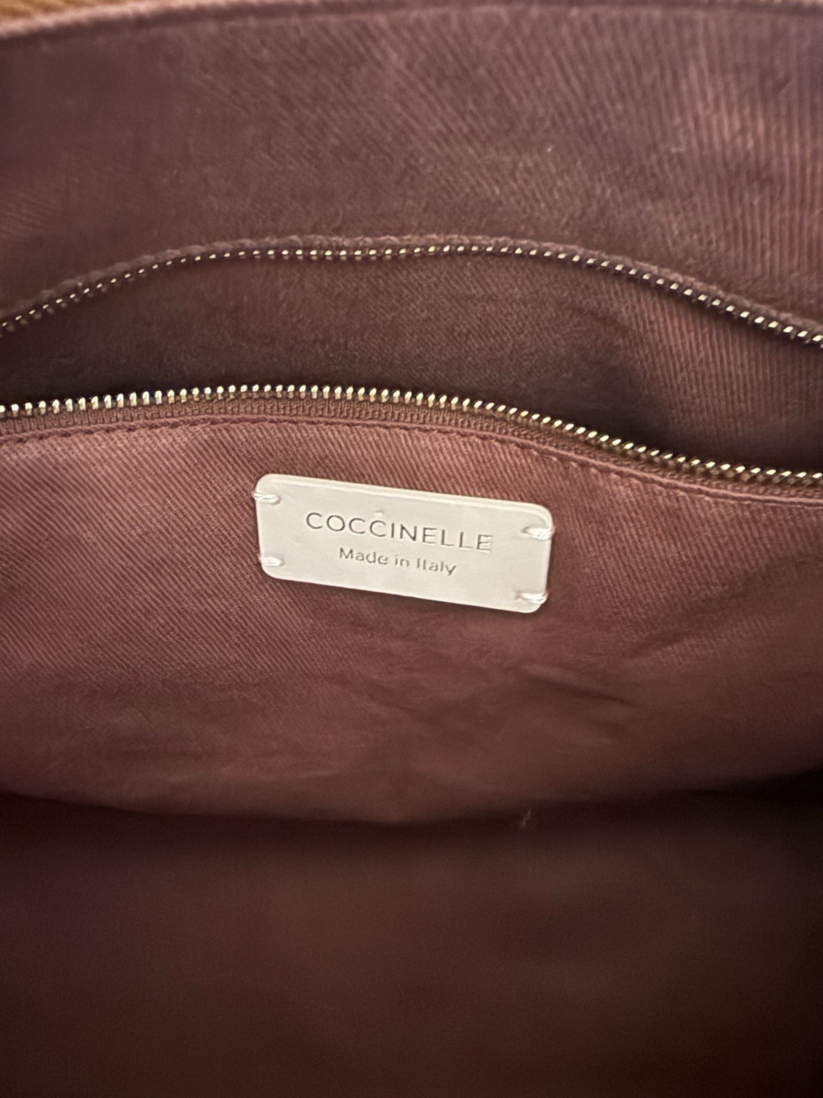 Coccinelle pebbled leather shoulder bag camel color