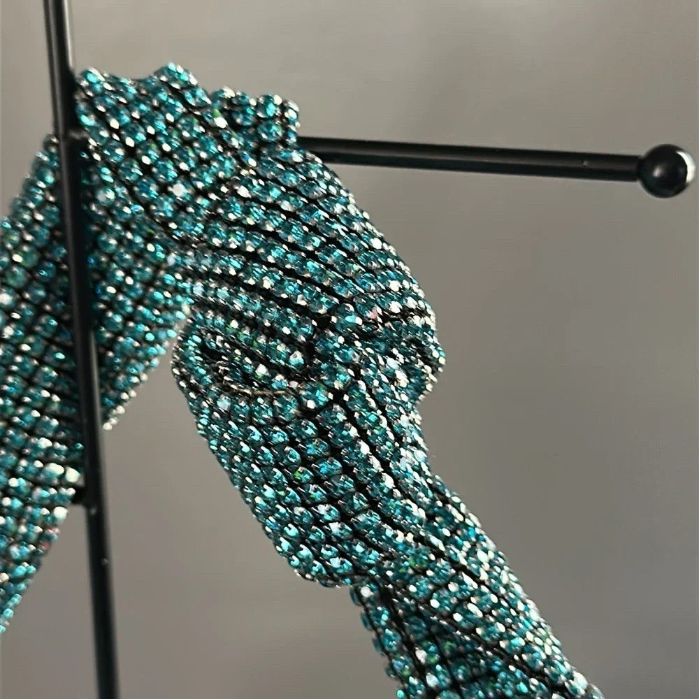 Madison West aqua knotted rhinestone dumpling handbag