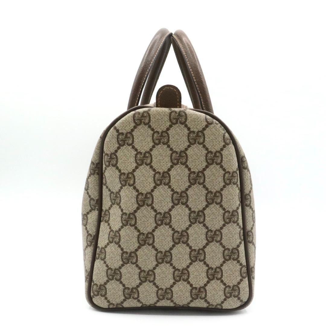 Gucci PVC canvas leather handbag, brown.