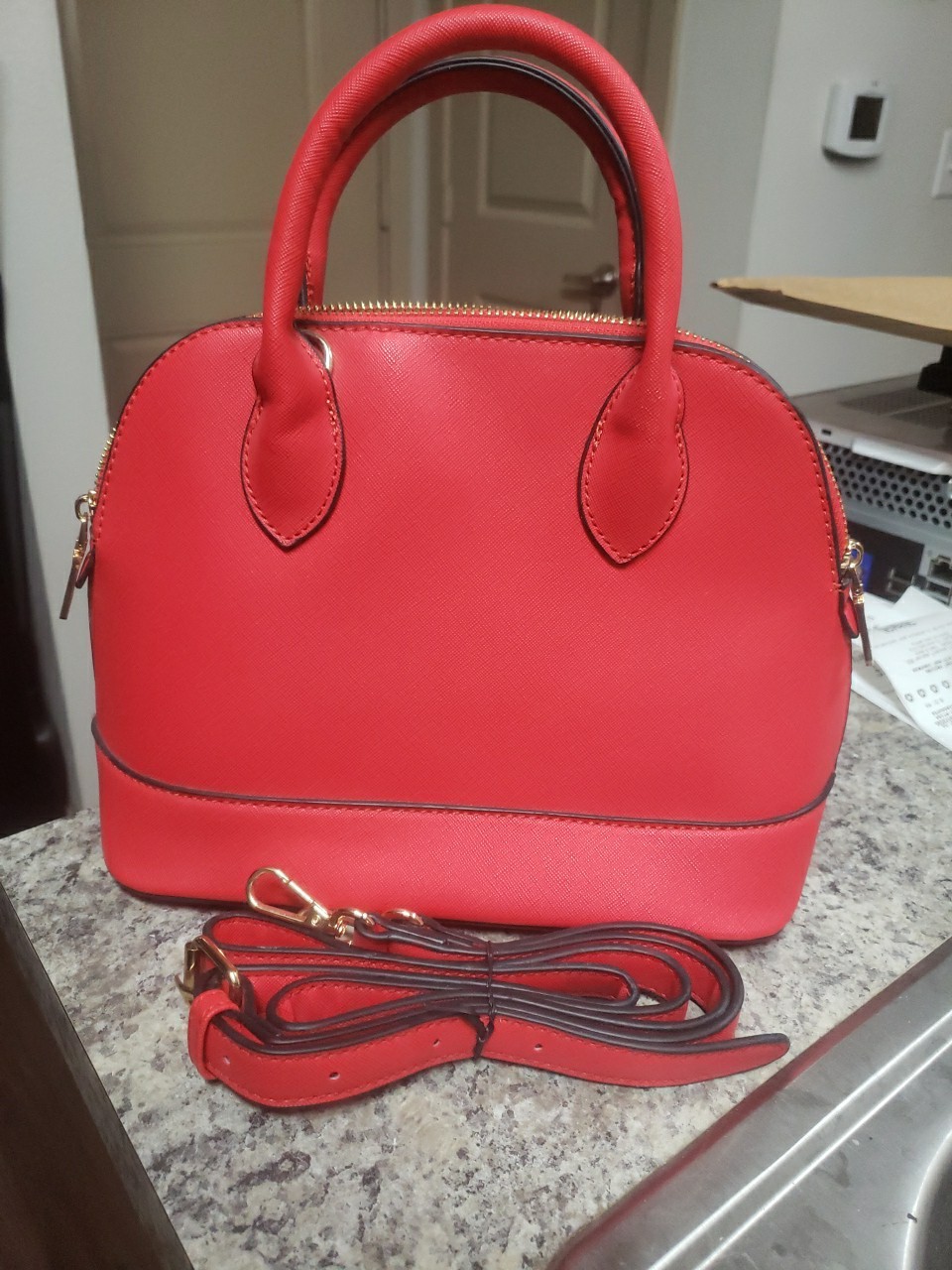 Red Purse With Gold Tones And Shoulder Strap