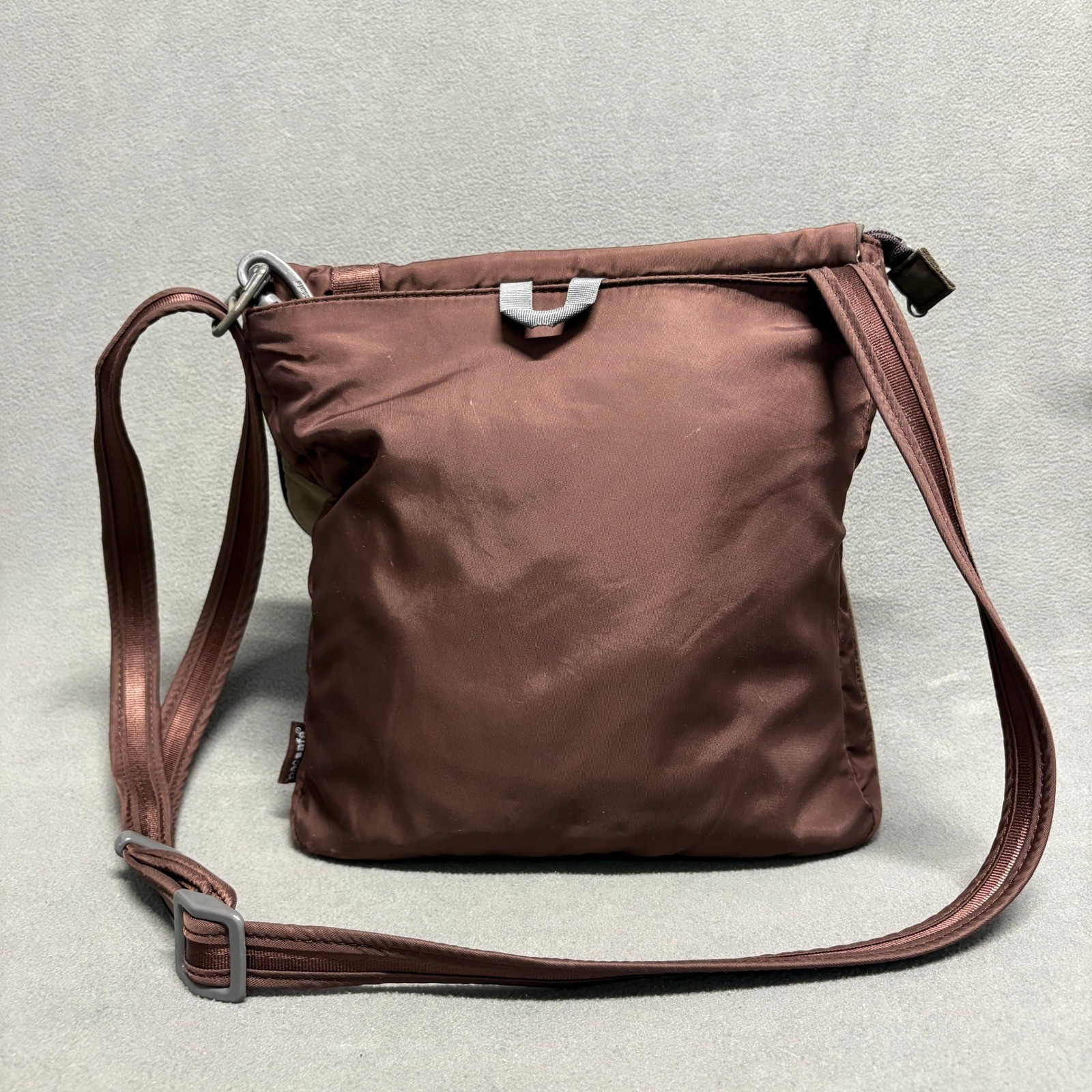PACSAFE SlingSafe 100 Exomesh Anti-Theft Safety Crossbody Bag in Brown